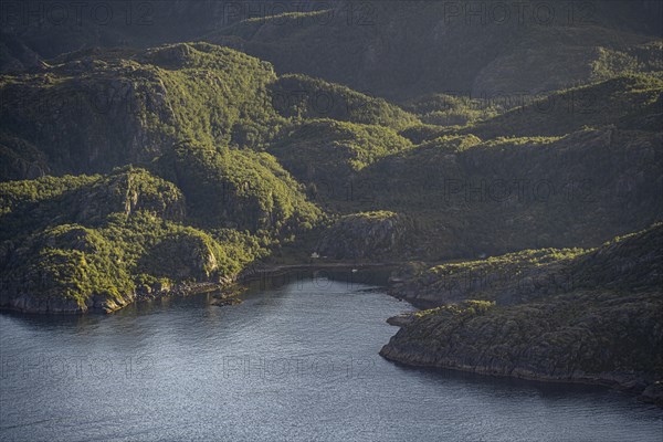 Coast in atmospheric evening light, view from the top of Dronningsvarden or Stortinden,