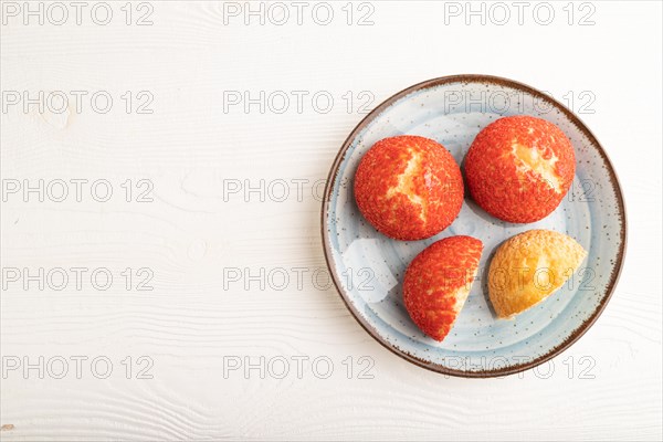 Traditional french custard dessert shu cake on white wooden background. top view, flat lay, copy