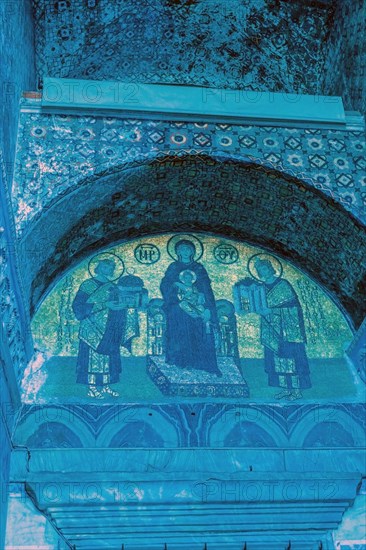 Virgin Mary holding the Christ Child inside Hagia Sophia Mosque. Noise or grain included in