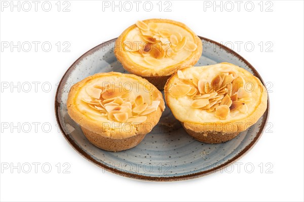 Traditional portuguese cakes pasteis de nata, custard small pies with almonds isolated on white