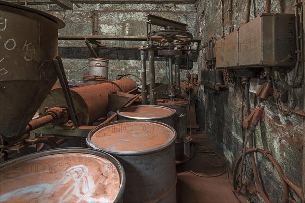 Bronze powder production room with filling bins in a metal powder mill, founded around 1900,