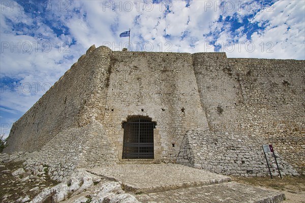 Fortress with Greek flag on a cloudy day, Chlemoutsi, High Medieval Crusader Castle, Kyllini