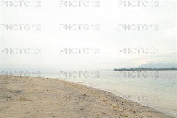 Lombok and Gili Air islands, overcast, cloudy day, sky and sea. Vacation, travel, tropics concept,