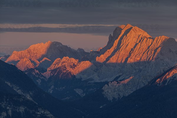 Distant view of steep mountains in the evening light, clouds, autumn, view from Wank to Karwendel