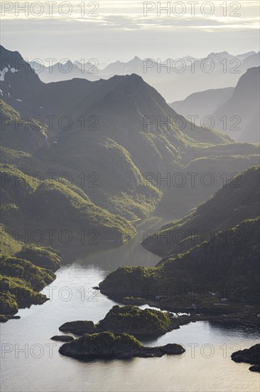 Fjord landscape with atmospheric evening light, Ulvagfjorden fjord and mountains, view from the top