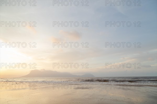 Bako national park, sea sandy beach, overcast, cloudy sunset, sky and sea, low tide. Vacation,