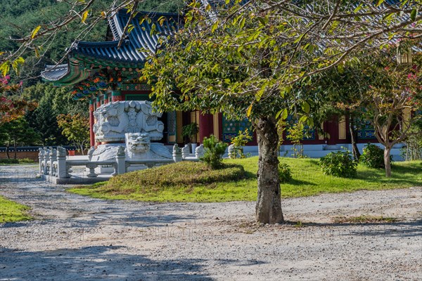 Rock carved dragons atop turtle in front of temple building at temple in Gimje-si, South Korea,