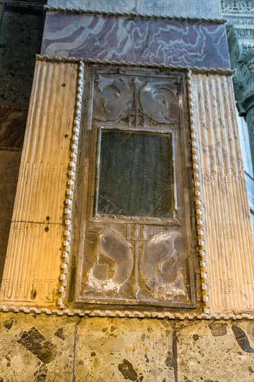 Plaque of Poseidon trident and dolphins on column wall inside Hagia Sophia Mosque in Istanbul,
