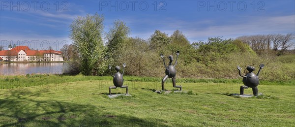 Three sculptures by Heinrich Kirchner in front of Seeon Monastery, dream weather in May, Seeon,