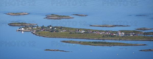 Rocky islands with colourful houses, sea with archipelago islands, Ulvagsundet, Vesteralen, Norway,