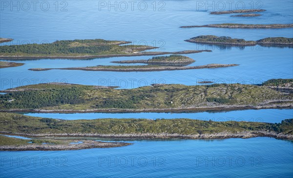 Rocky islands in the blue sea, sea with archipelago islands, Ulvagsundet, Vesteralen, Norway,