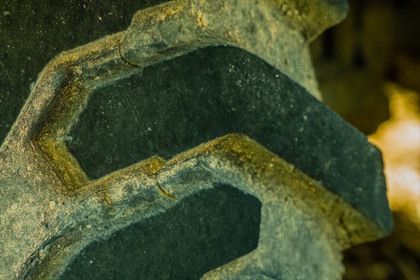 Closeup of tire tread of industrial heavy equipment roadwork machine