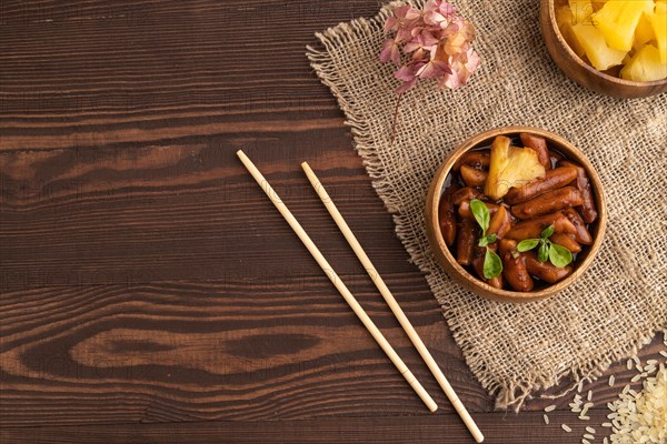 Tteokbokki or Topokki, fried rice cake stick, popular Korean street food with spicy jjajang sauce