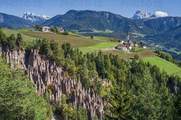 Earth pyramids on the Ritten at midday, Geislerspitzen and Schlern in the background, South Tyrol,