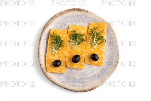 Marble cheese with olives and watercress microgreen isolated on white background. top view, flat