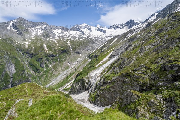 Picturesque mountain landscape with rocky mountains and glaciers, behind mountain peak Grosser