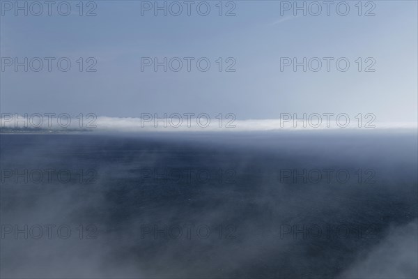 Coastal seascape in fog, Gulf of Saint Lawrence, Province of Quebec, Canada, sea, water, blue,