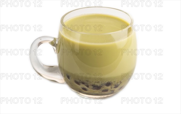 Bubble tea with pistachio and caramel in glass isolated on white background. Healthy drink concept.