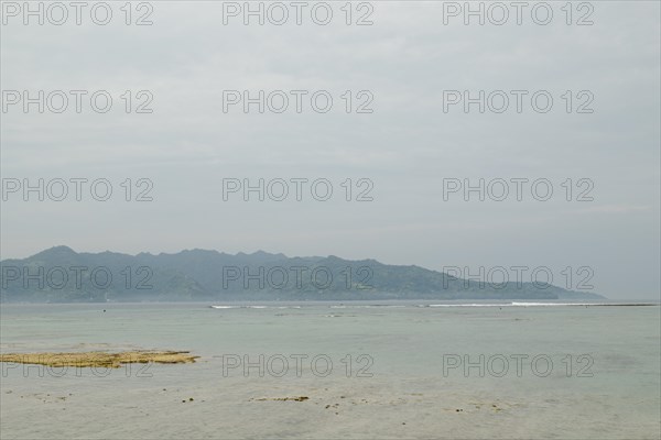 Lombok and Gili Air islands, overcast, cloudy day, sky and sea. Vacation, travel, tropics concept,