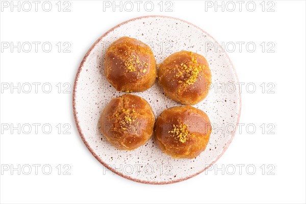 Homemade traditional turkish dessert sekerpare with almonds and honey isolated on white background.