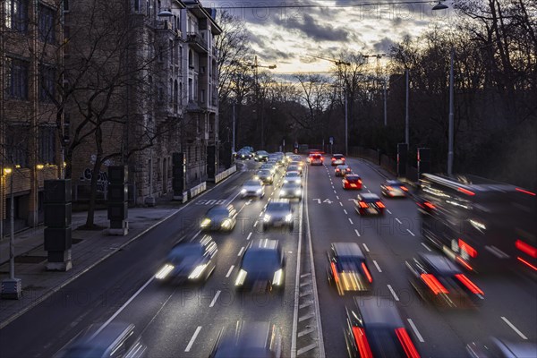 Cars with light trails in the evening, city centre traffic on busy B14 federal road at Neckartor,