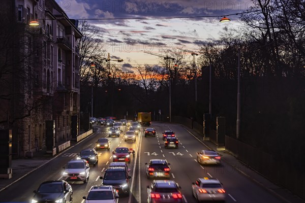 Cars with light trails in the evening, city centre traffic on busy B14 federal road at Neckartor,