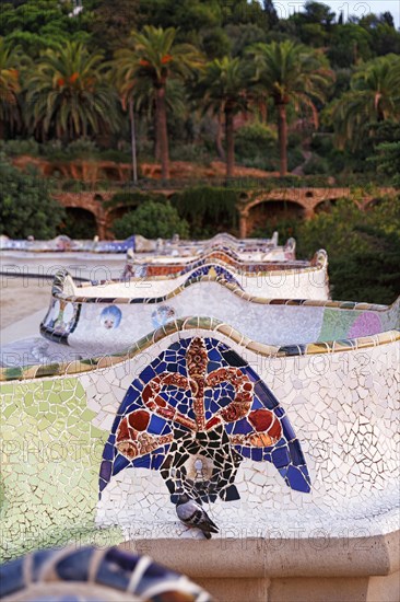 Curved bench, ceramic mosaic, Trencadis, viewing platform at sunrise, Park Güell, Barcelona,