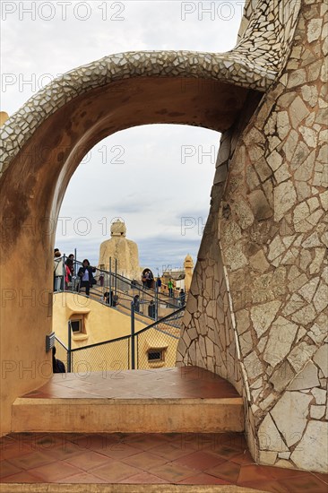 Tourists between artistically designed fireplaces on the roof terrace in the museum, Garden of the