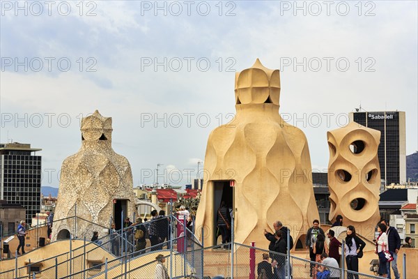 Tourist group between artistically designed fireplaces on the large viewing platform, roof terrace,