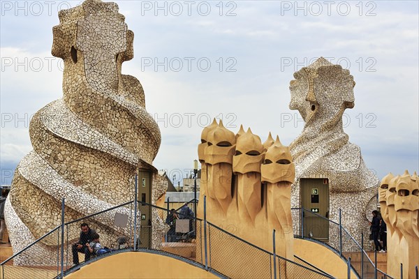 Tourists between artistically designed fireplaces on the large roof terrace, Garden of the