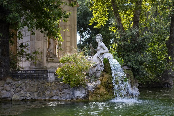 Temple of Aesculapius, Villa Borghese Lake. Water fountain statue detail. Rome, Italy, Europe