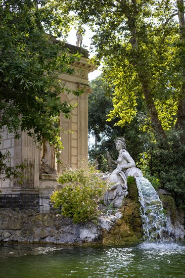 Temple of Aesculapius, Villa Borghese Lake. Water fountain statue detail. Rome, Italy, Europe