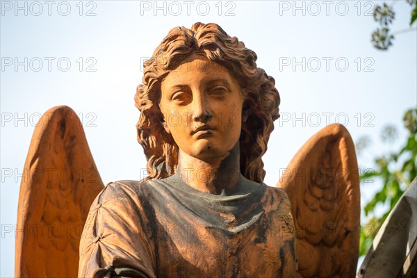 Terracotta-coloured angel statue, female angel figure, angel statue with curls and finely crafted