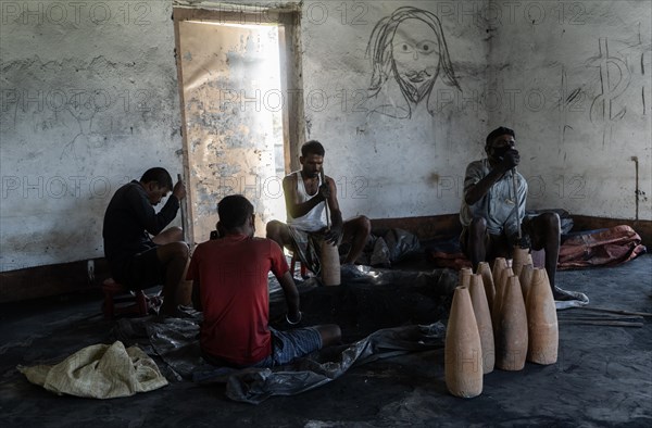 BARPETA, INDIA, NOVEMBER 7: Workers making firecrackers at a workshop for upcoming Diwali or