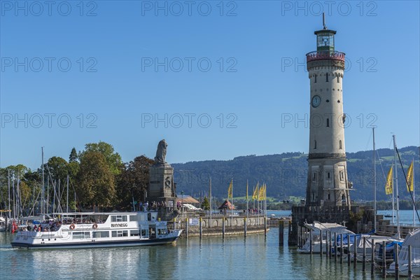 Lindau at Lake Constance, entrance to the harbour, new lighthouse, Bavarian lion, passenger ship,