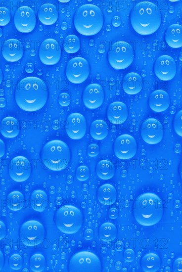 Lots of funny little blue water drops on a blue surface, a smiley face reflected in each drop