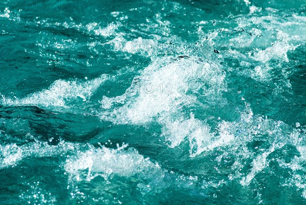 Turquoise-coloured foaming clear water of a mountain stream near Hinterriss, Bavaria, Germany,