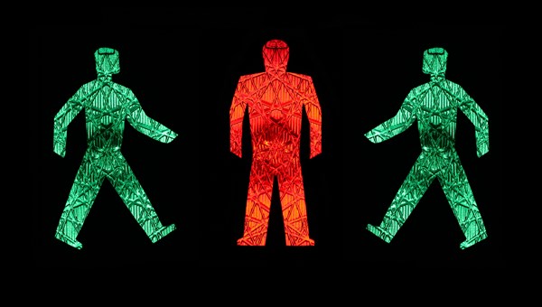 Two green traffic light men walking towards a standing red one, pictograms, pedestrian lights