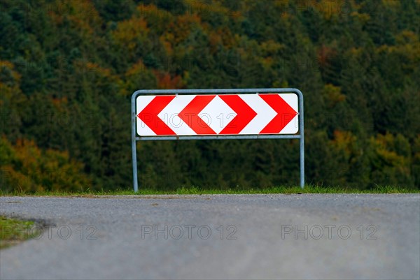 Fork in the road in Germany, a sign shows the possible directions right and left, symbolising a