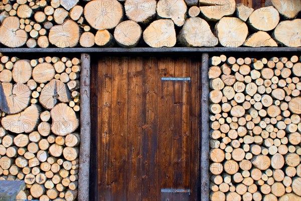 Picturesque woodpile, more for decoration, sawn logs, at a wooden hut near Garmisch-Partenkirchen,