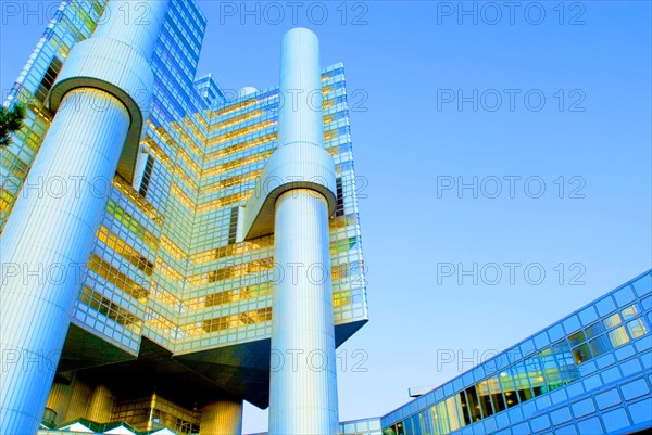 HVB Tower or Hypo-Haus, headquarters of Hypovereinsbank, Unicredit, in Arabellapark at dusk, blue