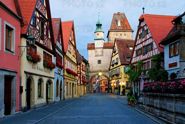 Town view with old half-timbered houses and old town gate in Rothenburg ob der Tauber, blue hour,