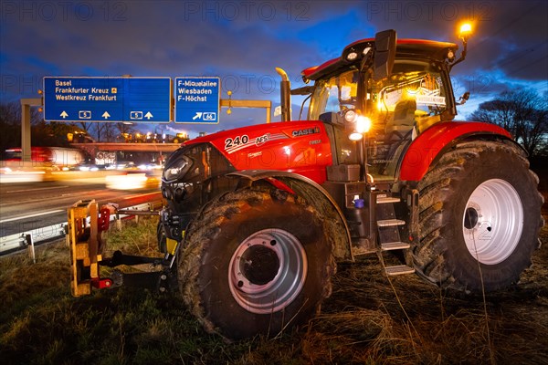 Numerous farmers gathered in the evening with their tractors and warning lights switched on on and