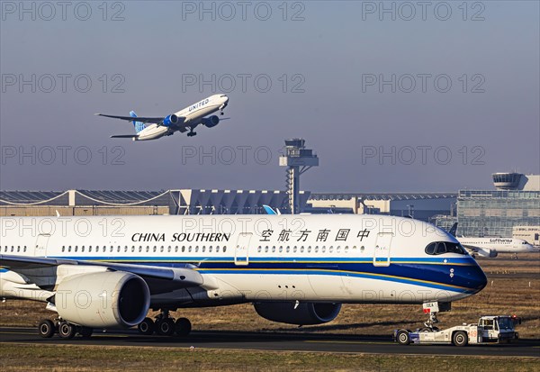 United Airlines aircraft taking off at Frankfurt Airport, Fraport Airport with tower. B-30EA, CHINA