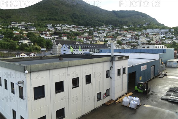 Port buildings and traditional houses in coastal town of Kristiansund, Romsdal county, Norway,