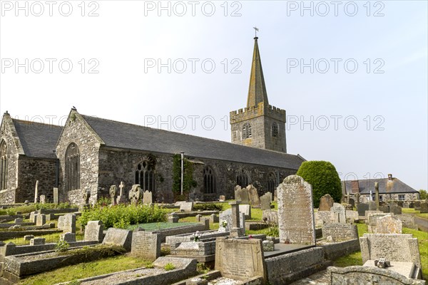 Spire and gravestones village parish church at St Keverne, Lizard Peninsula, Cornwall, England, UK