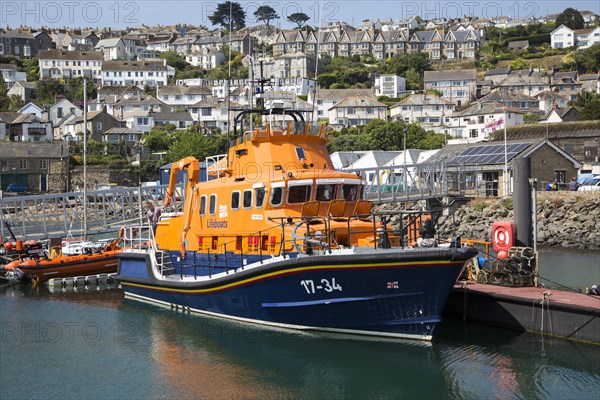 RNLI lifeboat in the harbour of fishing port of Newlyn, Cornwall, England, UK