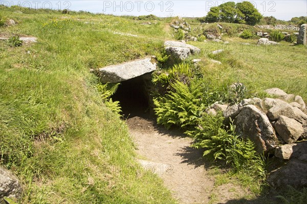 Entrance to underground fogue tunnel, Carn Euny prehistoric village, Cornwall, England, UK