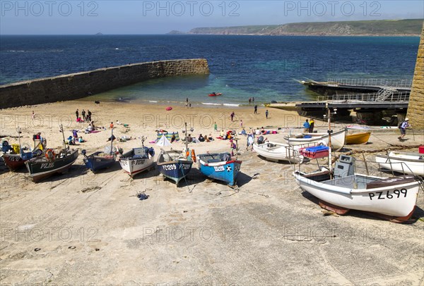 Fishing boats and breakwater in the harbour, Sennan Cove, Land's End, Cornwall, England, UK