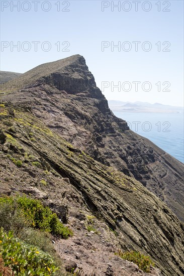 Steep coastal cliffs Risco de Famara looking south from Guinate, Lanzarote, Canary Islands, Spain,